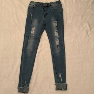 Light blue ripped jeans